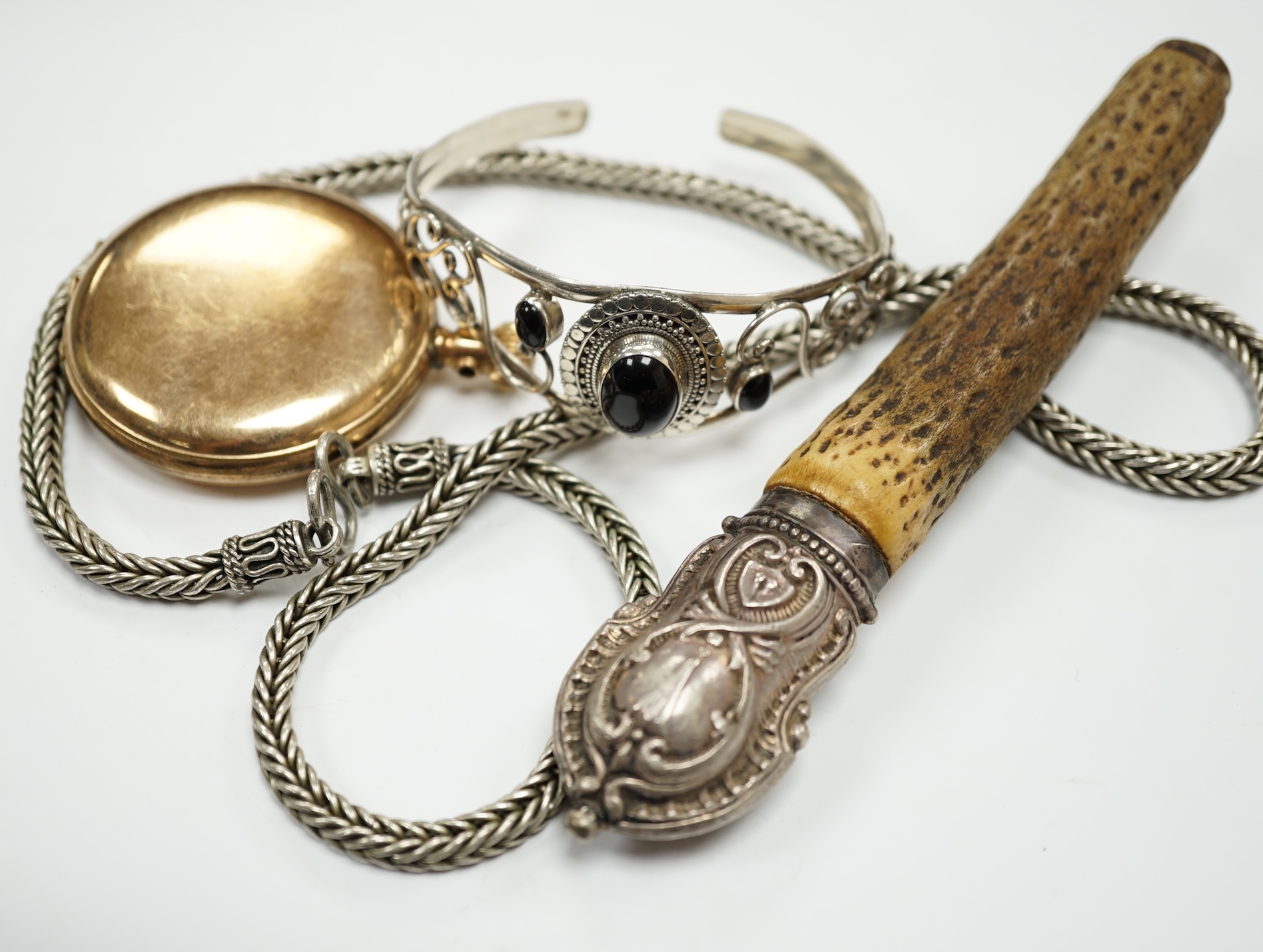 A small quantity of assorted mainly white metal and 925 jewellery including a bangle, necklaces, chains etc., housed in a wooden box. Condition - poor to fair to good